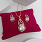 Royal Halo Pear-Cut American Diamond Pendant Set in Rose Gold Plating