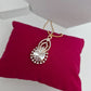 Royal Halo Pear-Cut American Diamond Pendant Set in Rose Gold Plating