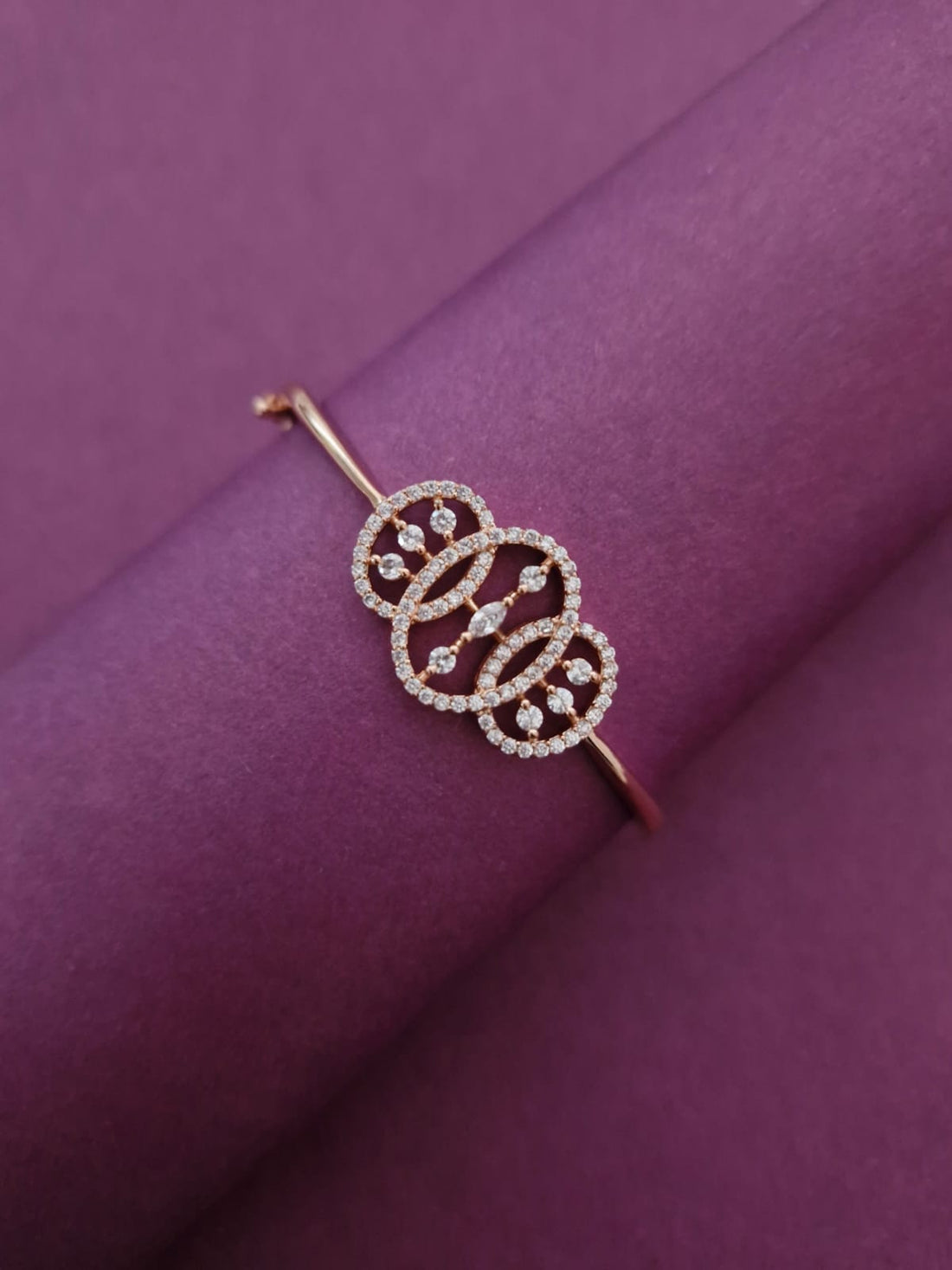 Rose Gold-Tone Interlocking Circle American Diamond Bangle